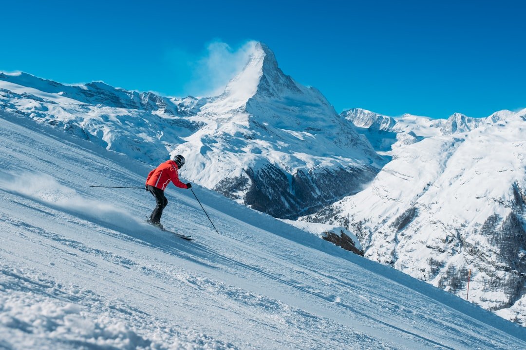 services-03 a-skier-going-down-a-slope-ivhzn4flnbc